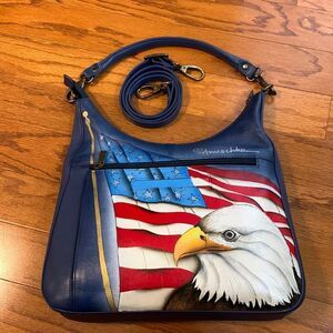 Anuschka crossbody w/adjustable strap and small handle to change to shoulder bag